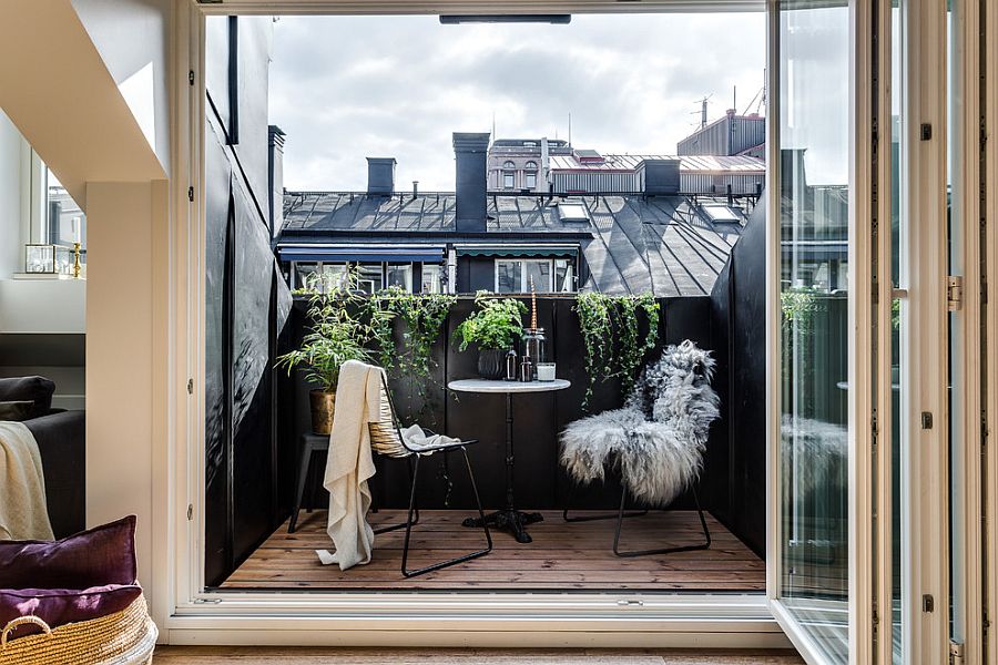 Folding doors separate this balcony in black from the master bedroom