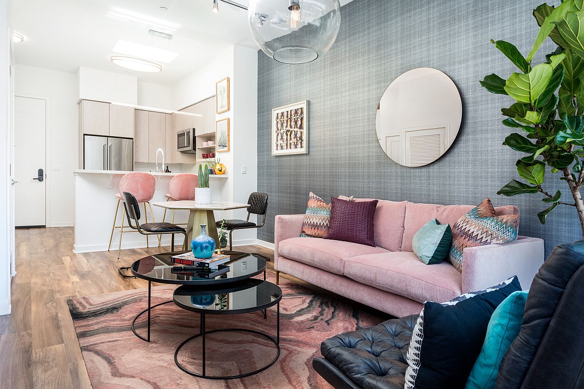 Gorgeous pink and gray living room with multi-colored accent pillows