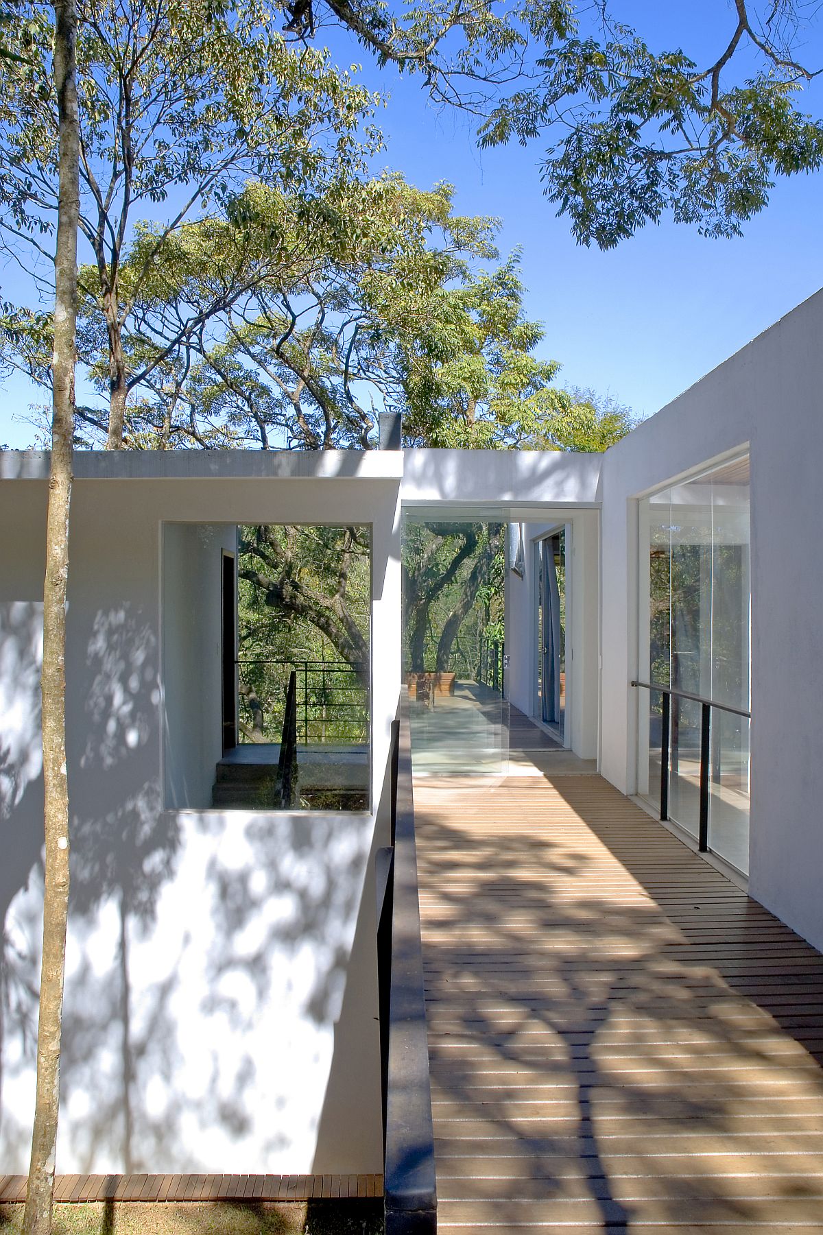 Gorgeous wooden walkway extends outside the house