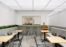 Gray-and-white-are-coupled-with-splashes-of-greenery-and-concrete-inside-the-restaurant-29851-217x155