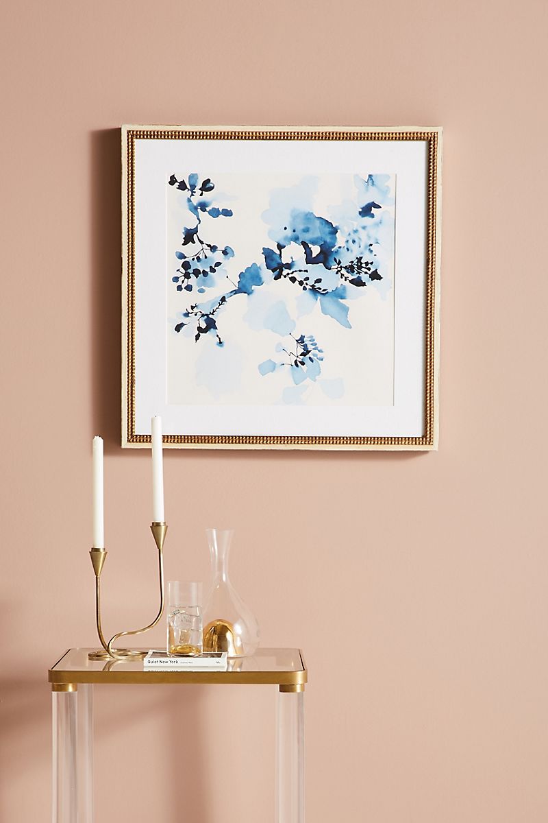 Indigo and white art against a peach backdrop