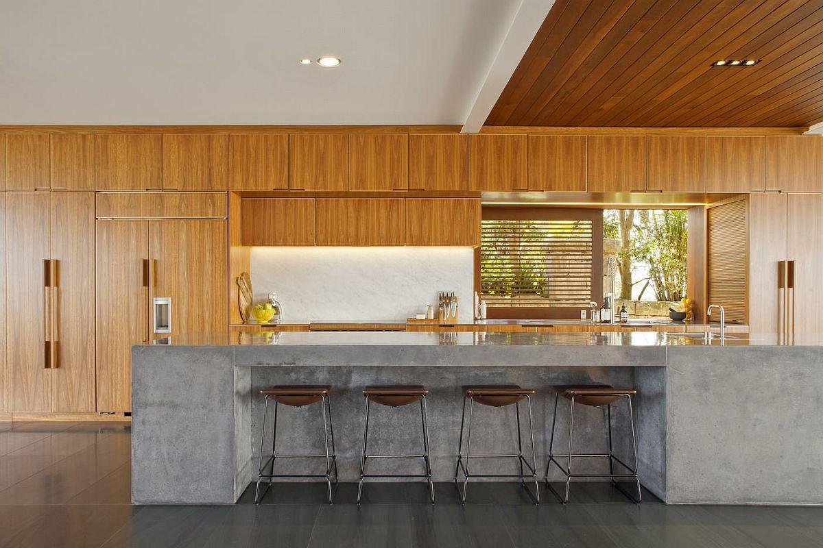 Large concrete islands in the kitchen and both practical and durable