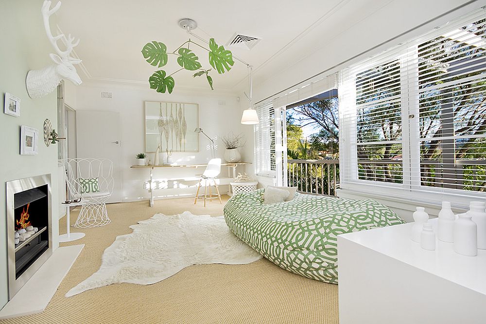 Lounge area and home office of the Aussie home in white with curated green accents