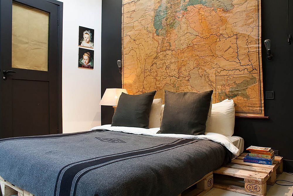 Map on the walls along with the photos adds a slight vintage touch to the modern industrial bedroom
