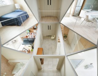 Geometric Masterpiece: Hexagonal Atrium Enlivens Modern Home with 12 Rooms