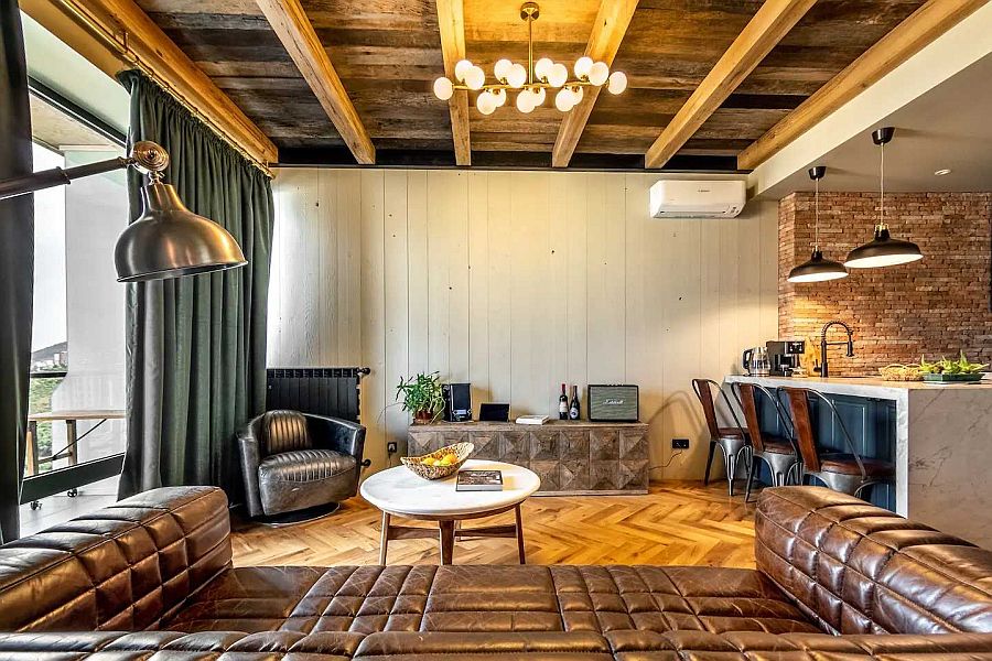 Modern-industrial-apartment-living-room-with-luxurious-leather-sofa-and-wooden-ceiling-and-floors-82891