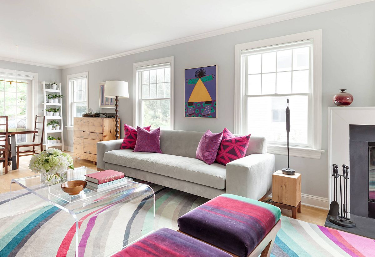 Multi-colored cushions, accent pillows and rug for the spacious contemporary living room
