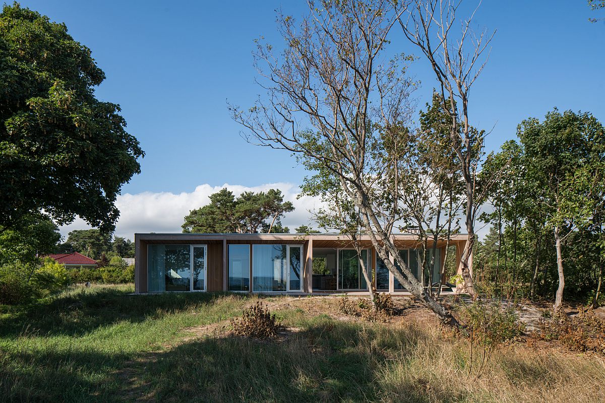 Natural greenery and canopy around the modern summerhouse