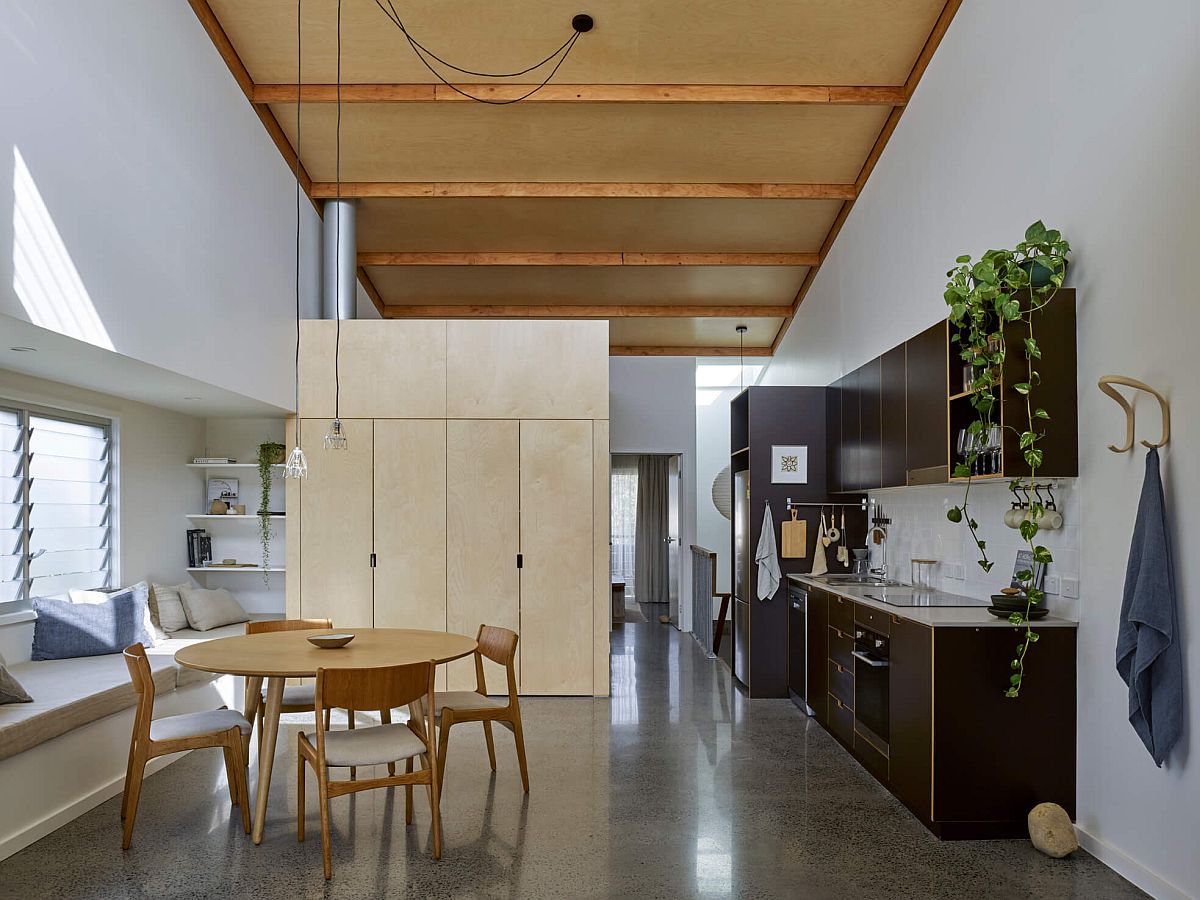 Open plan living area, dining space and kitchen of the single bedroom apartment unit