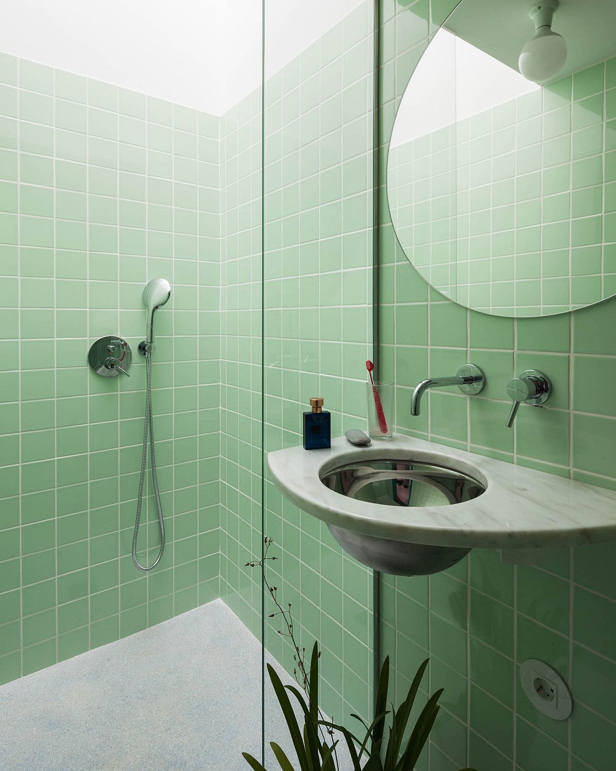 Paste green bathroom with ample natural light inside