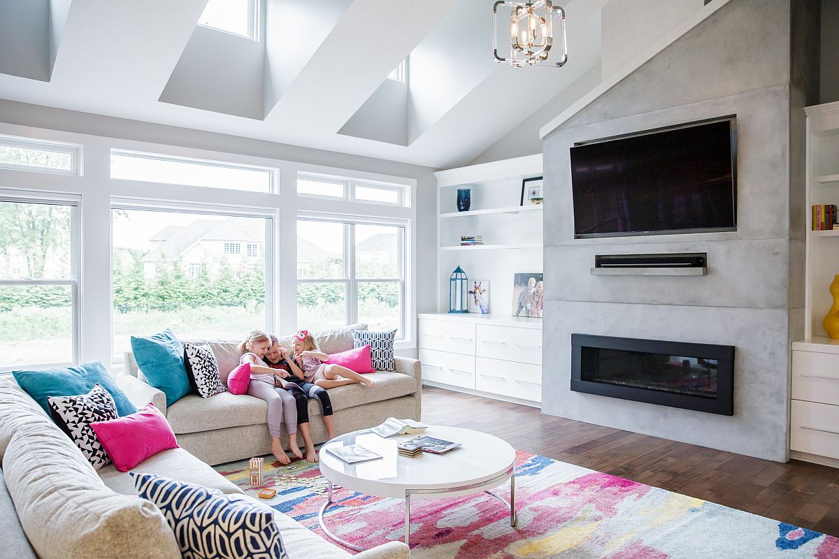 Pink and blue accent pillows for the neutral colored couch