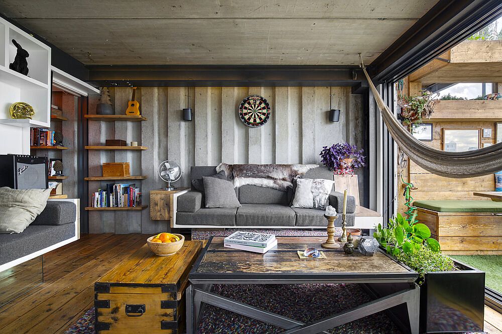 Rustic accessories coupled with an industrial backdrop inside the space-savvy London apartment