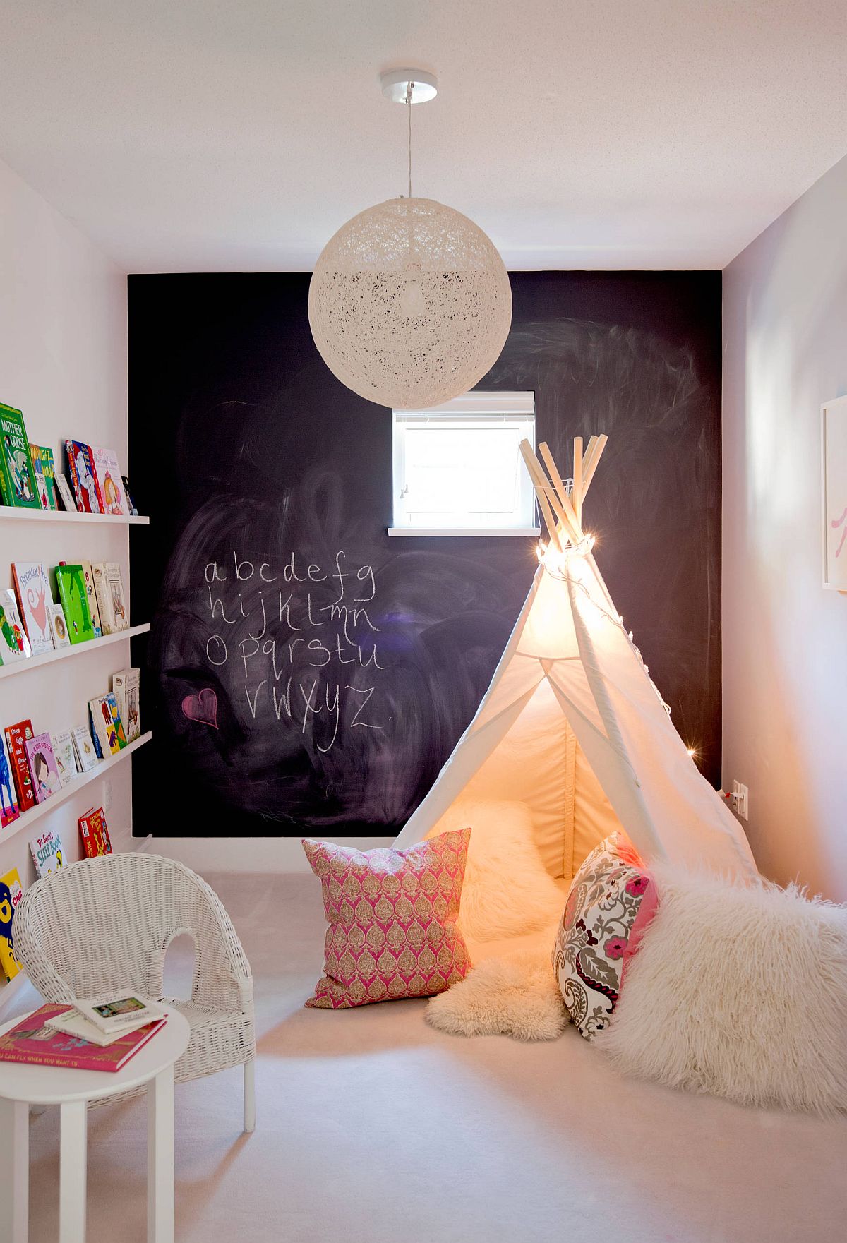 Small eclectic style kids' playroom with chalkboard wall and carpeted floor