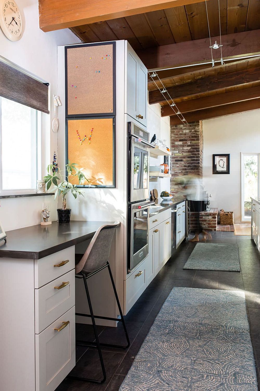 Small niche next to the kitchen transformed into a midcentury modern home workspace