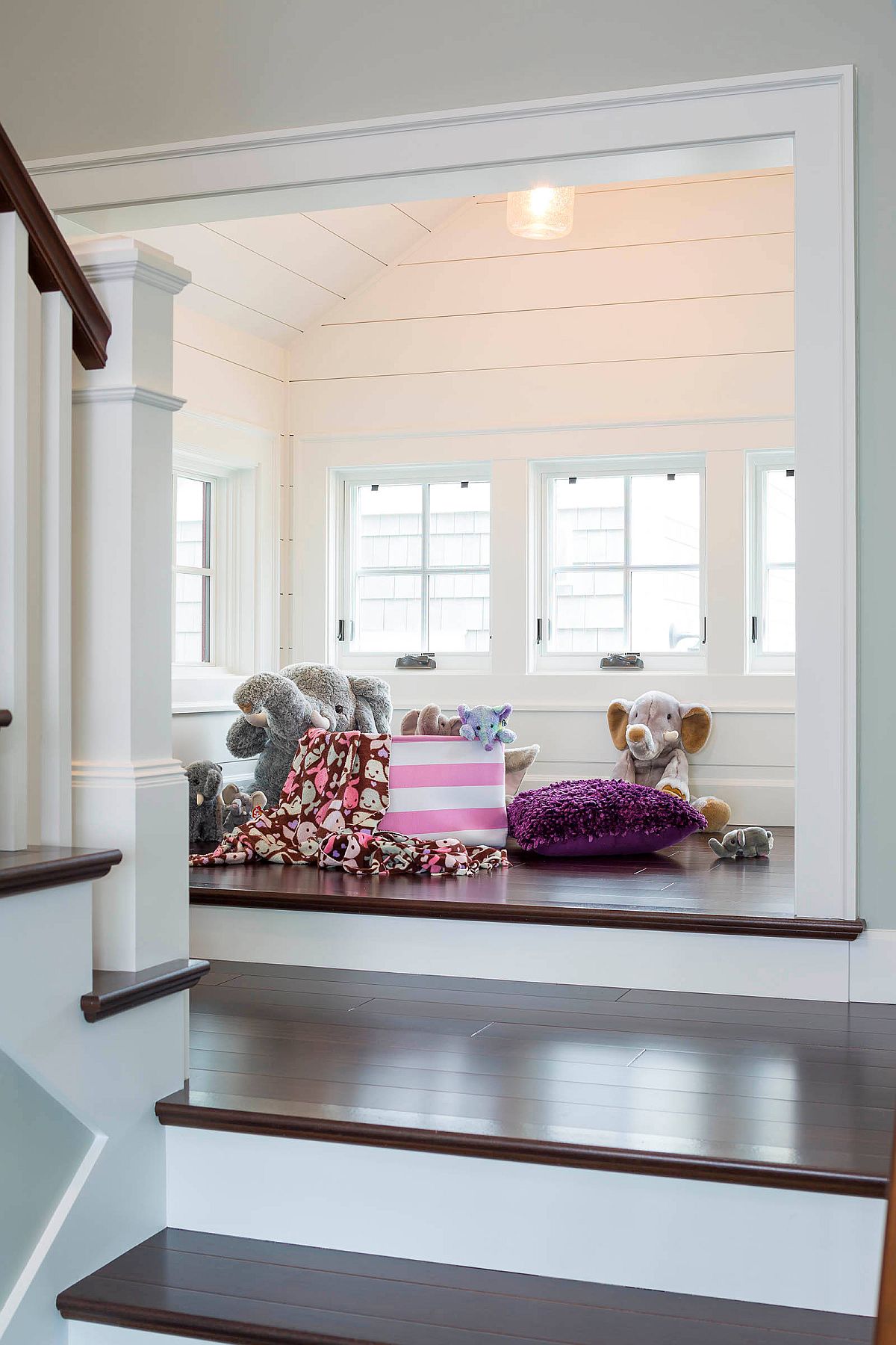 Soft toys and floor cushions are all you need to turn that empty area into a playroom