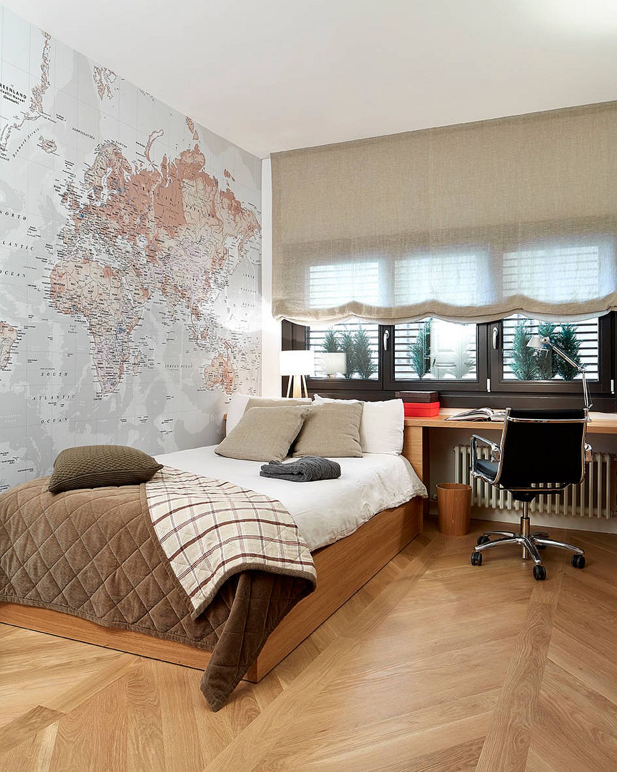Space-savvy modern bedroom where the map on the wall becomes the focal point