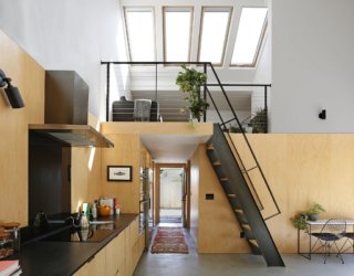 Space-Conscious Backyard House in Seattle with Metal Exterior and Wood on the Inside