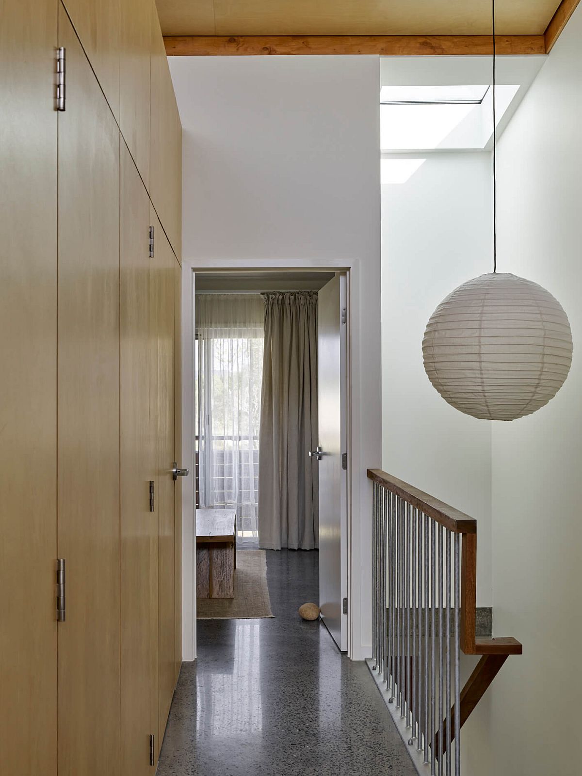 Stairwell brings natural light into the lower level of the unit as well