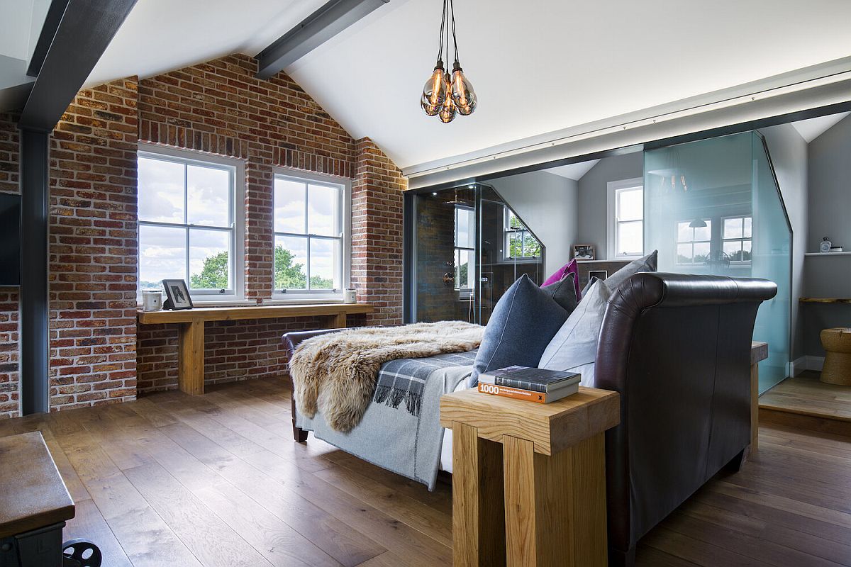 Steel ceiling beams and brick walls are combined beautifully with contemporary finishes inside the master suite