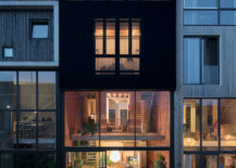Striking-black-perforated-corrugated-sheeting-shapes-the-exterior-of-the-house-as-lighting-illuminates-it-elegantly-47887-217x155