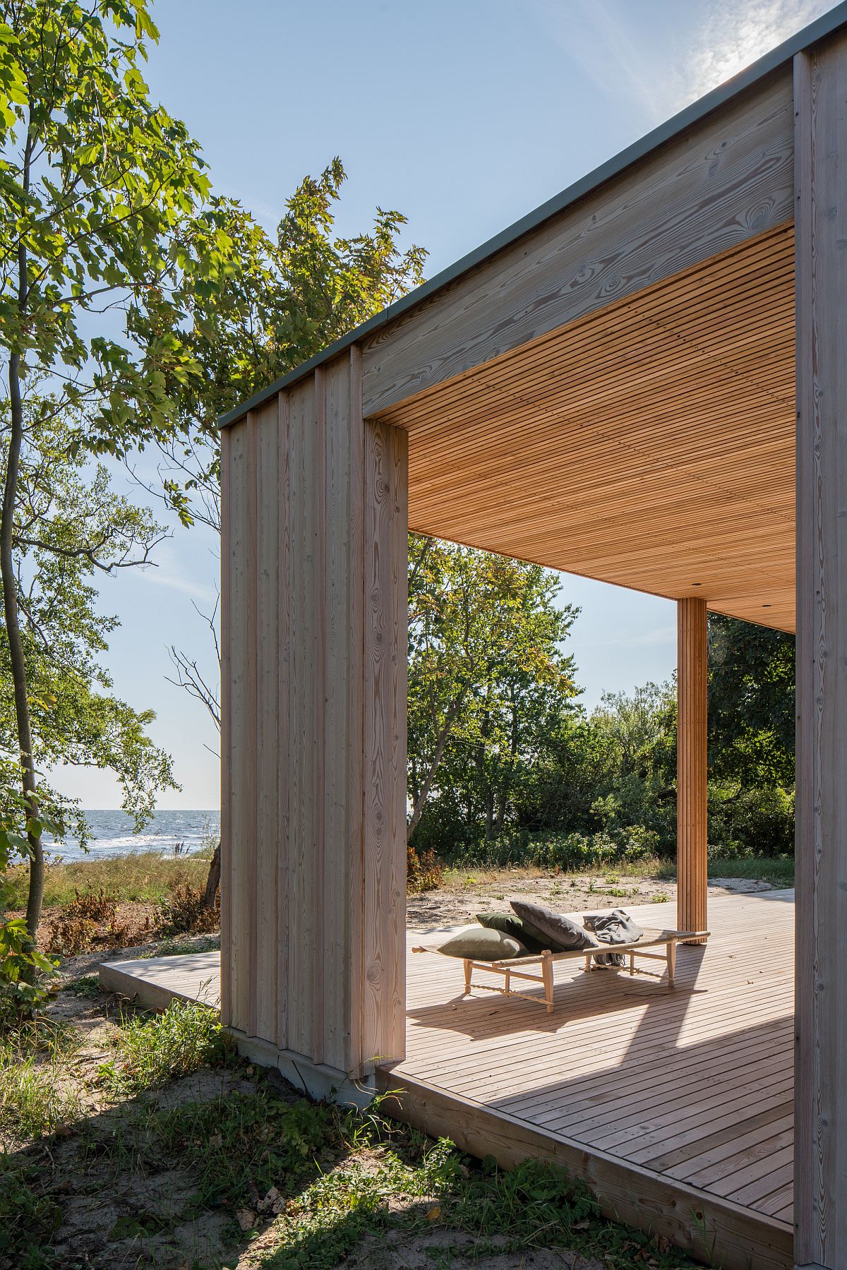 Sun-soaked deck of the house allows the homeowners to enjoy the many sights and sounds next to the baltic sea