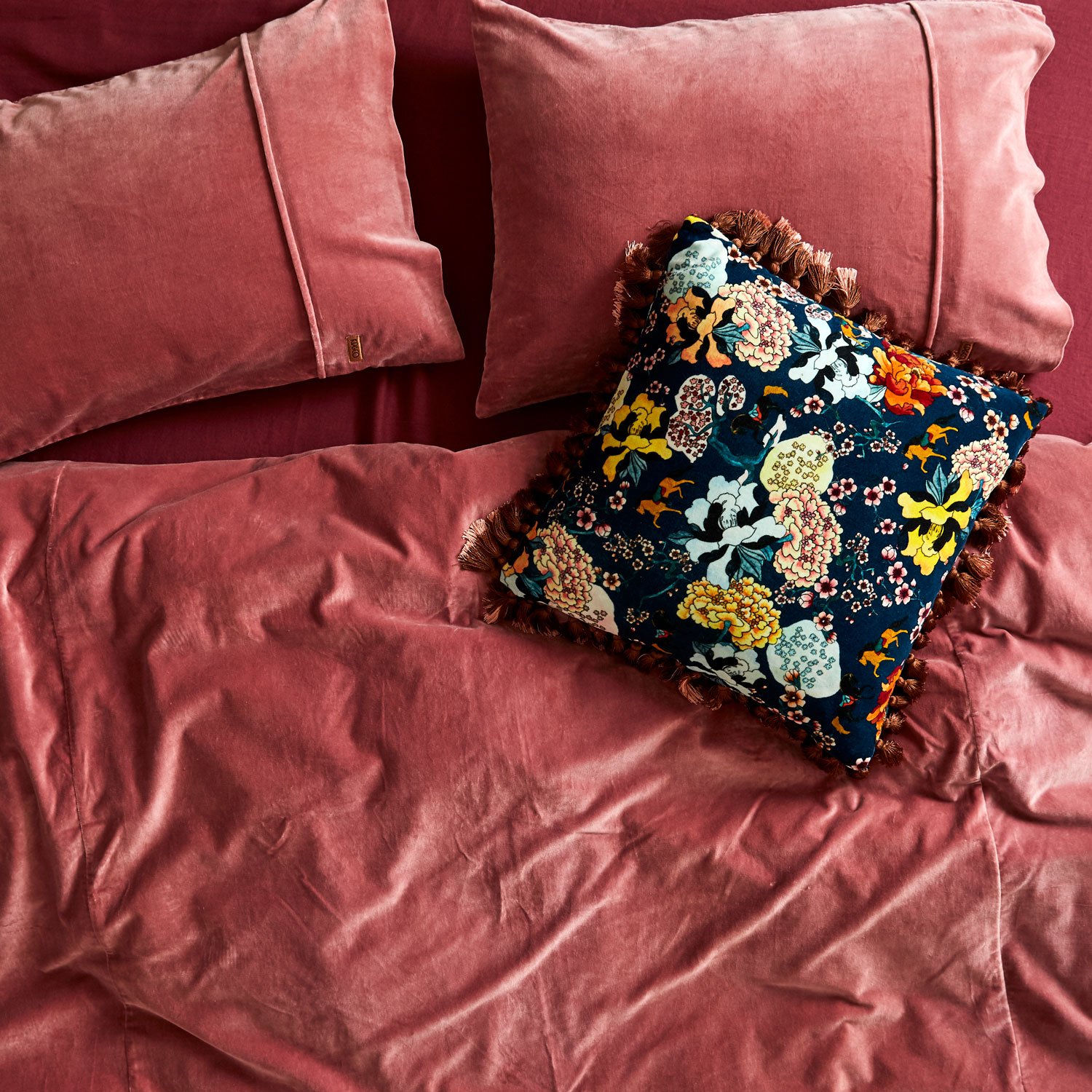 Tasseled floral pillow from Kip & Co.