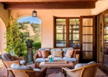 Textured-walls-in-pastel-orange-and-dashing-wooden-beams-give-this-Mediterranean-porch-a-captivating-appeal-30400-217x155