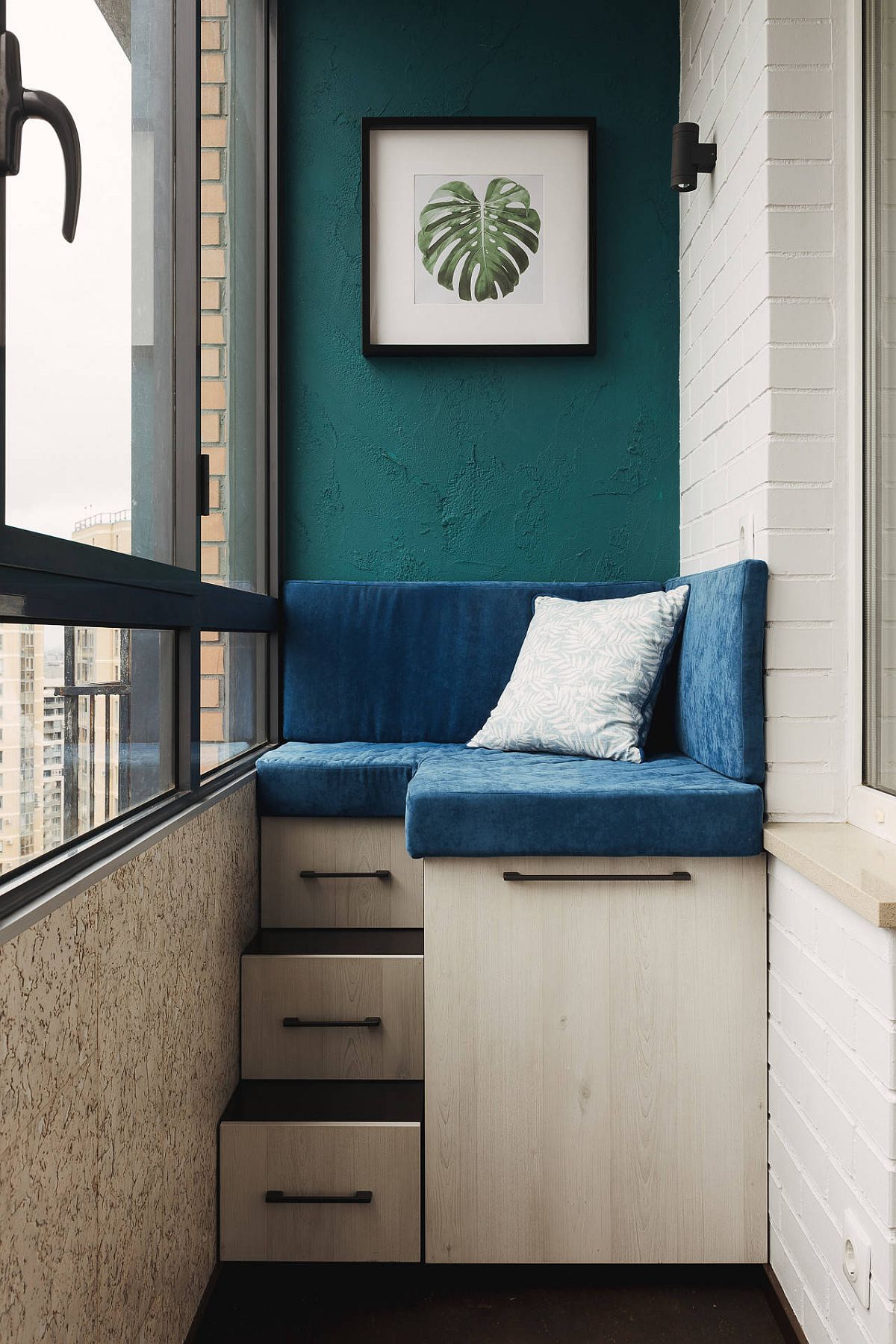 Ultra-small modern balcony with a corner custom bench that offers plenty of storage space