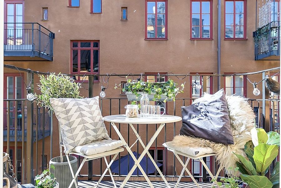 Use string lighting to illuminate the tiny balcony without taking up space