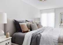 White-and-gray-bedroom-with-low-ceiling-and-cozy-textiles-47964-217x155
