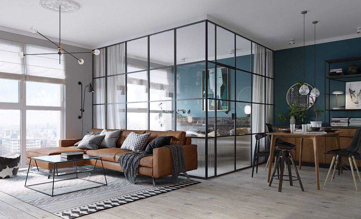 Awesome glass walls with dark frame separate the bedroom from the living area inside this small Kiev apartment