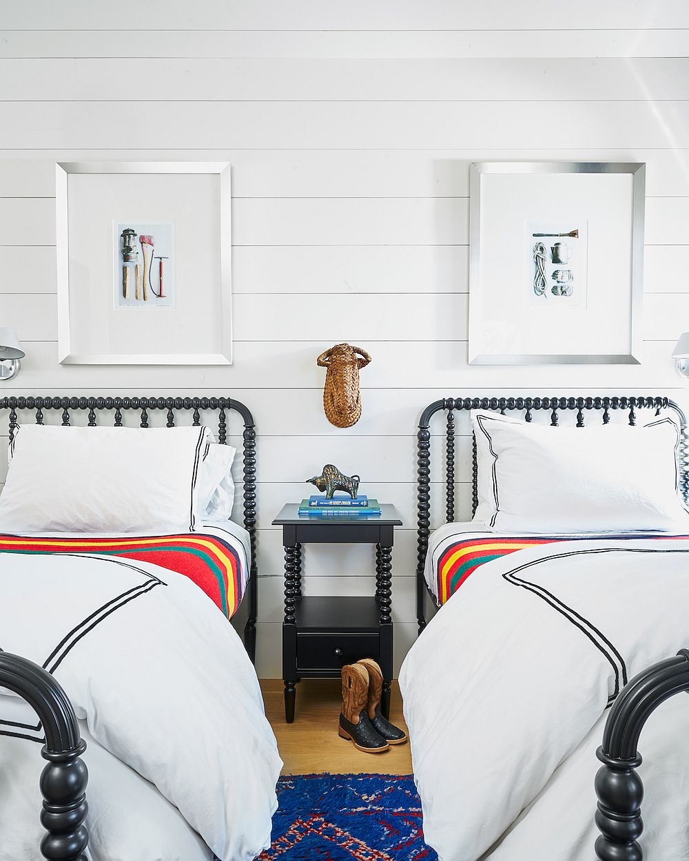 Beds with iron frame enhance the traditional racnch style of the bedroom in white