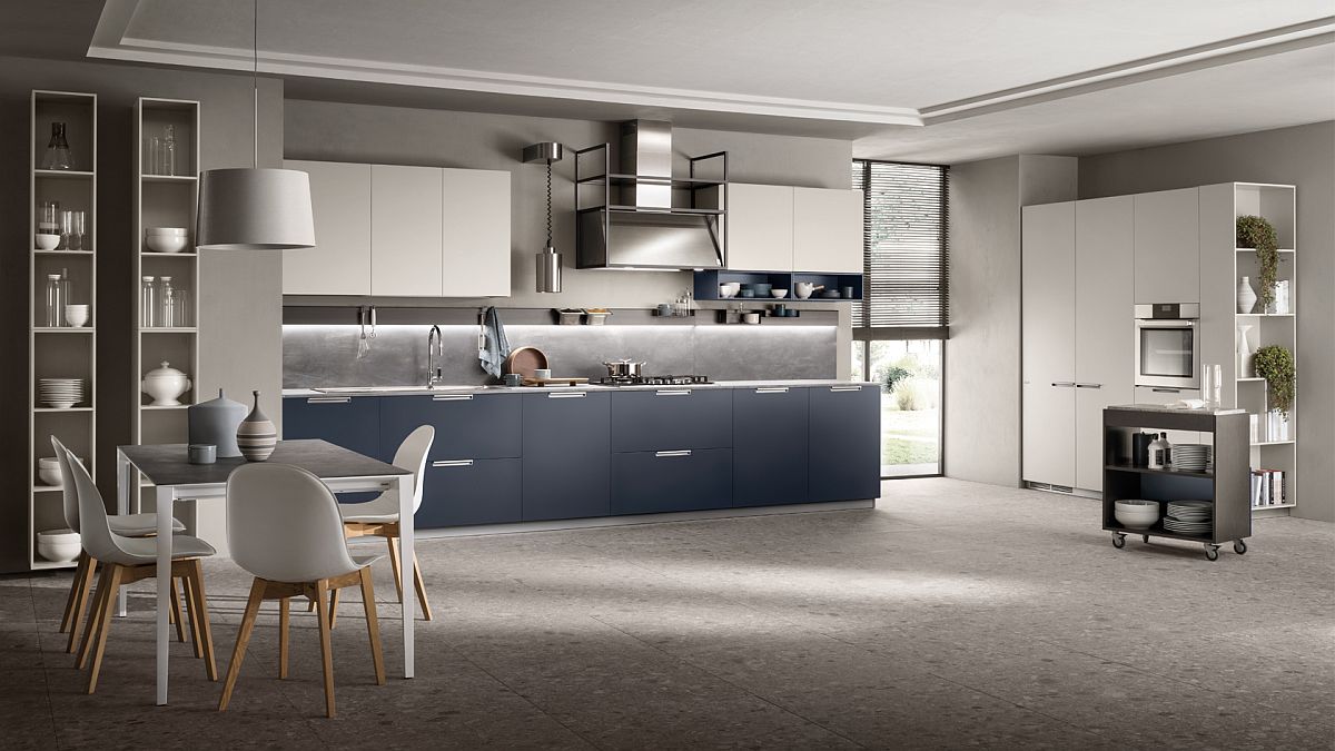 Blue cabinets coupled withwhite countertops and smart shelving in the MIA kitchen from Scavolini