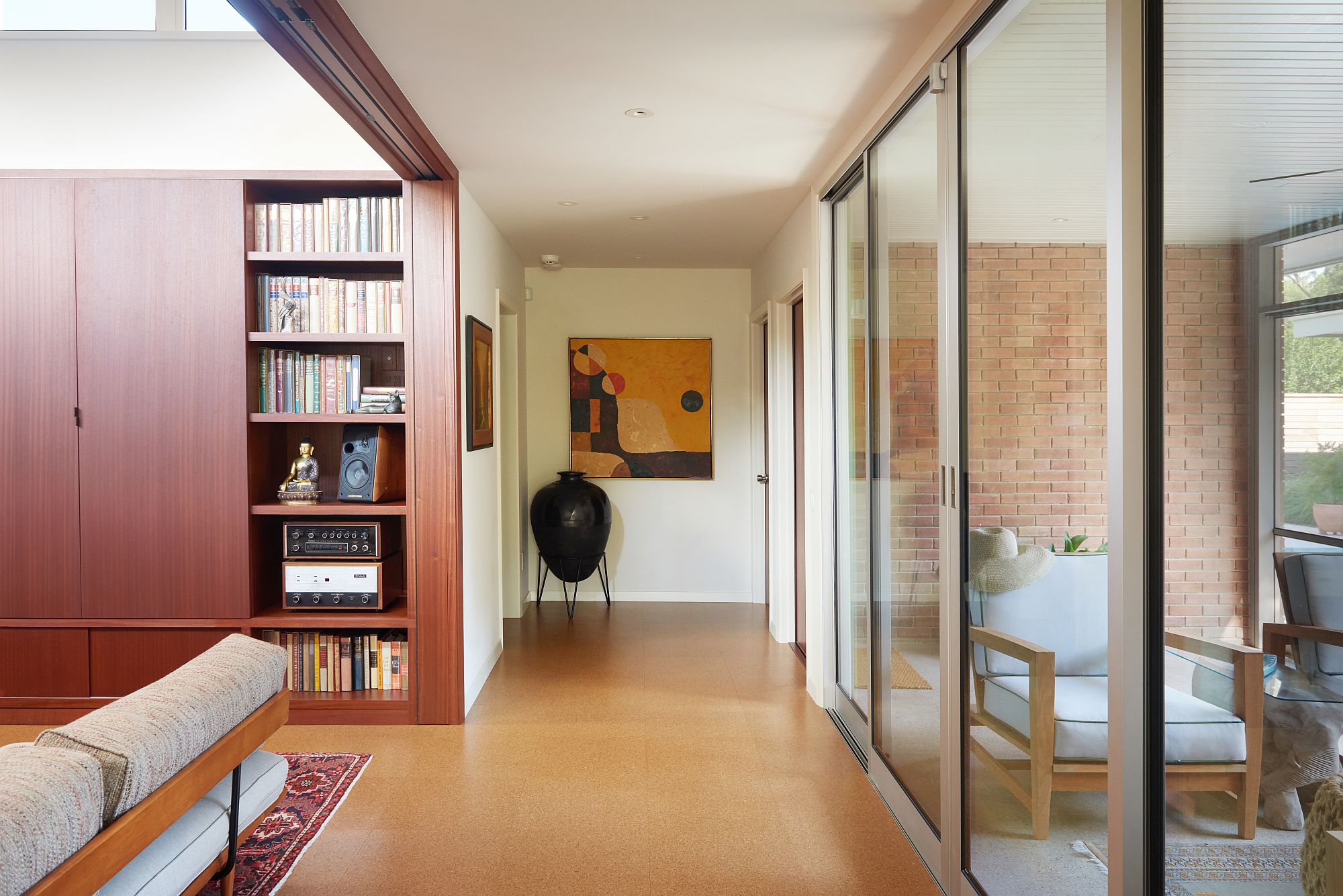 Brick walls and revamped entrance welcome you at this gorgeous Austin home