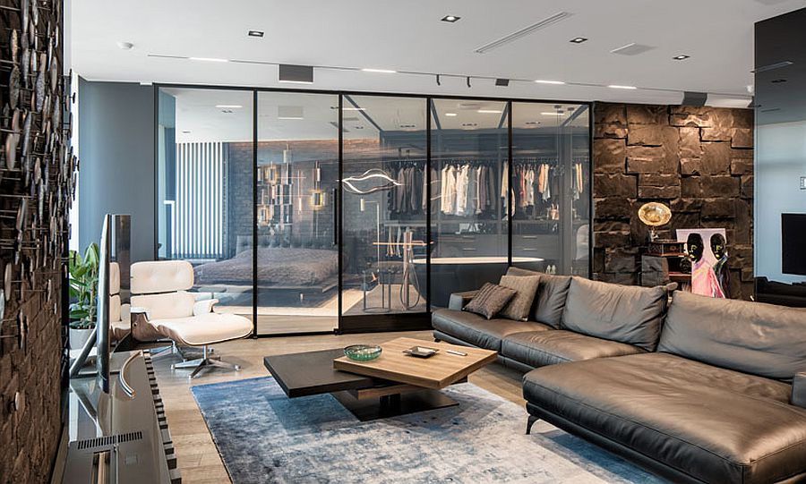 Brilliant blend of glass and stone inside this trendy apartment that saves space