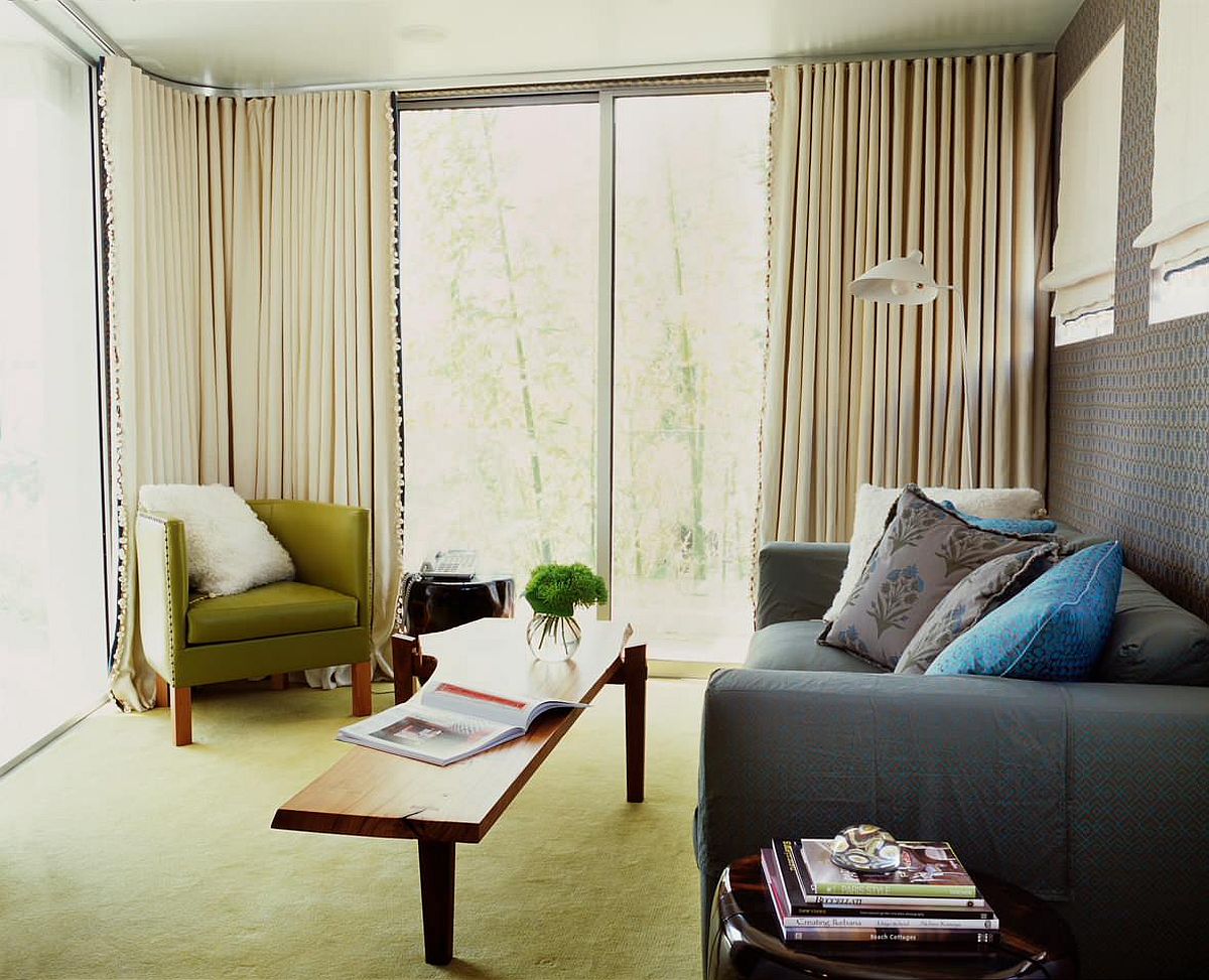 living room with olive green rug and chair for accent