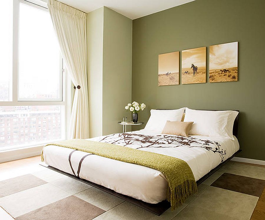 Contemporary bedroom of New York home with accent wall in olive green