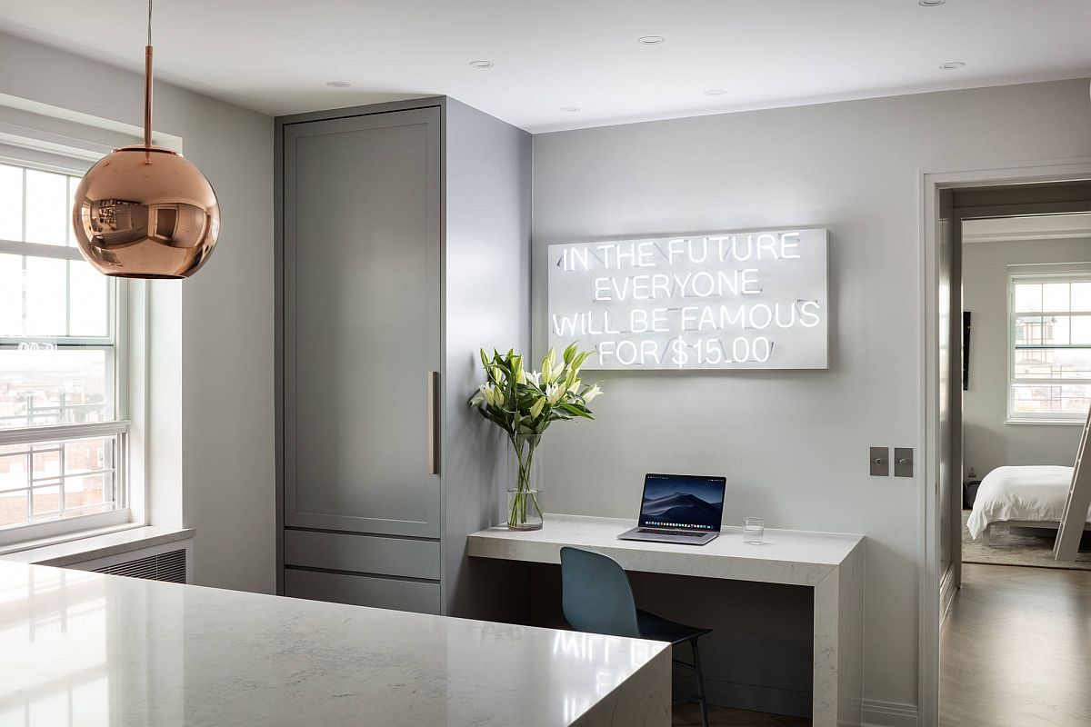 Contemporary industrial kitchen in gray with home workspace and a bright neon sign