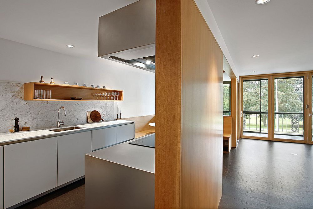 Contemporary kitchen in white and wood with floor in cork