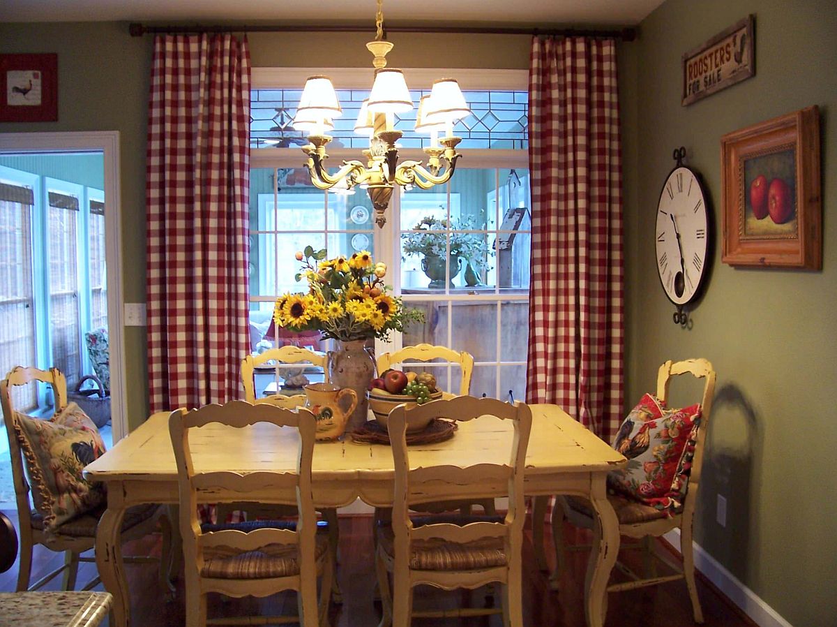 Curtains in plaid with a dash of red and walls in green create a festive dining room