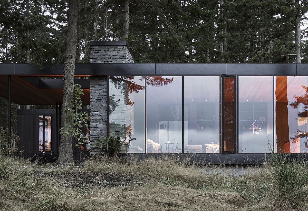Dark metal, stone and glass combined to create a gorgeous modern rustic home