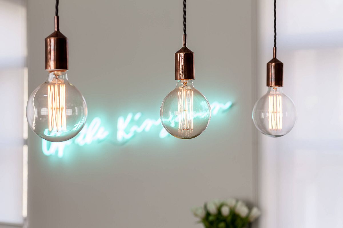 Edison bulb lighting combined with sparkling neon sign in the contemporary kitchen