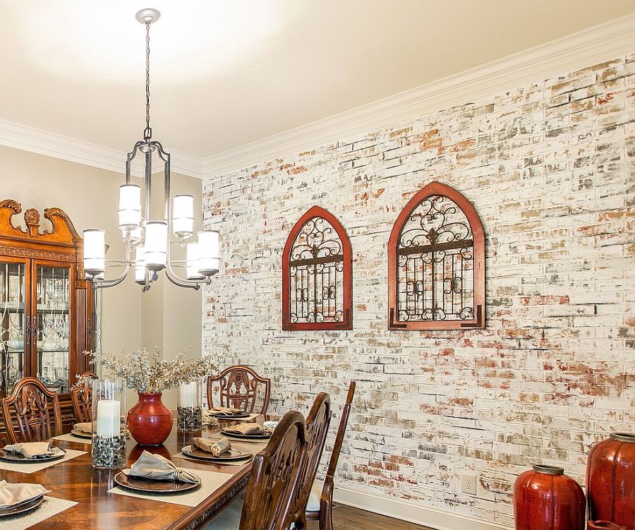 Farmhouse style dining room with lovely whitewashed brick wall, classic decor and antique pieces