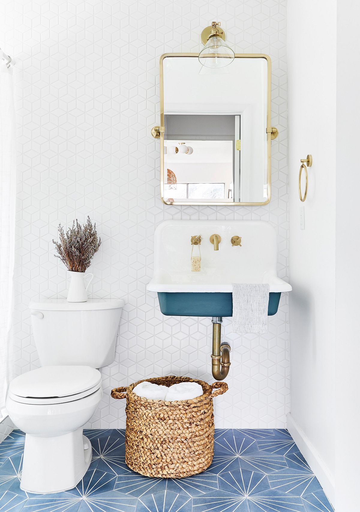 Floor tile adds more than just color to this small modern bathroom in white and blue