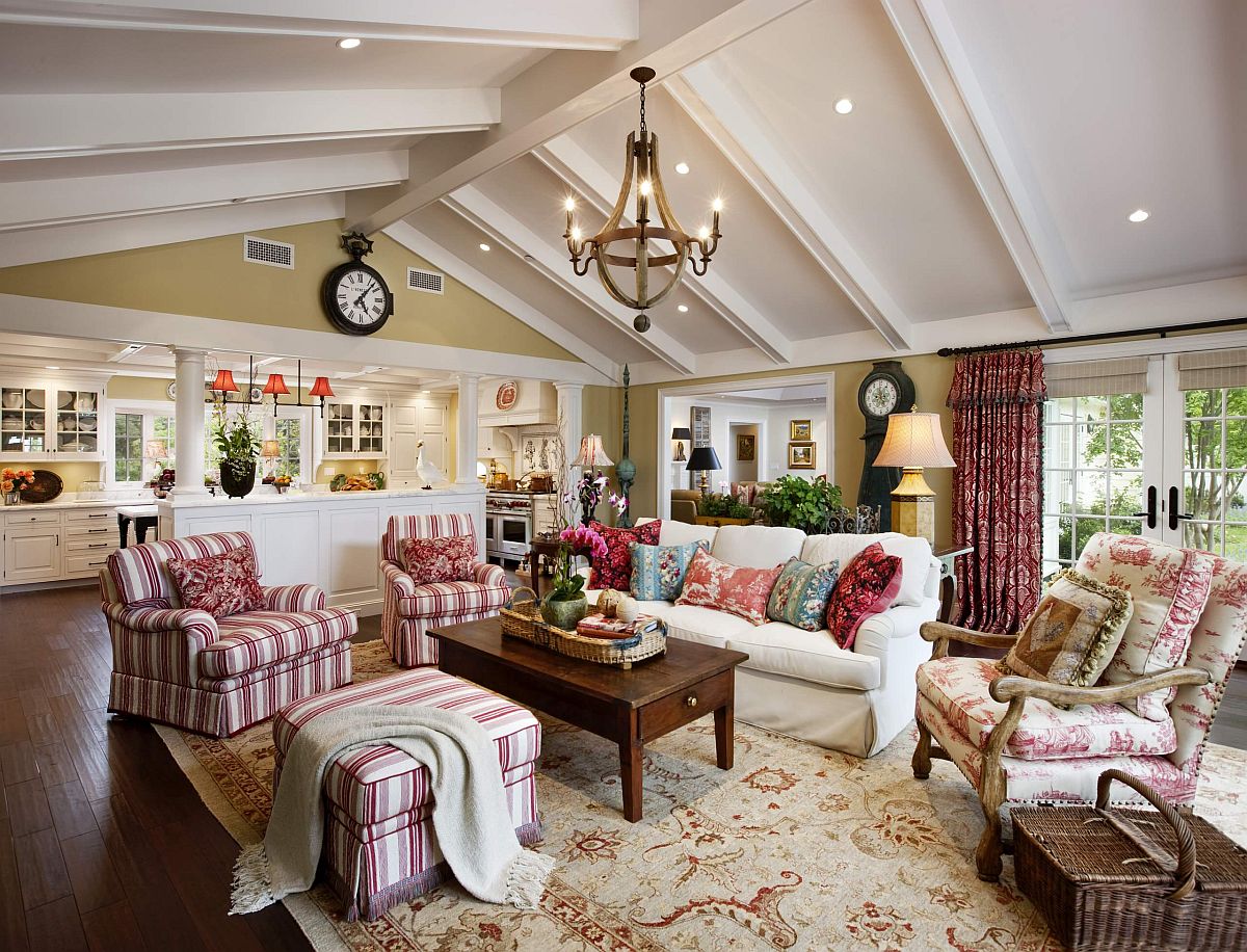 Gorgeous striped chairs in pink steal the show in this traditional family room