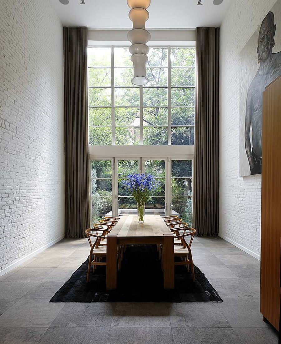 It is hard to find a more dramatic and stunning dining room with whitewashed bick walls