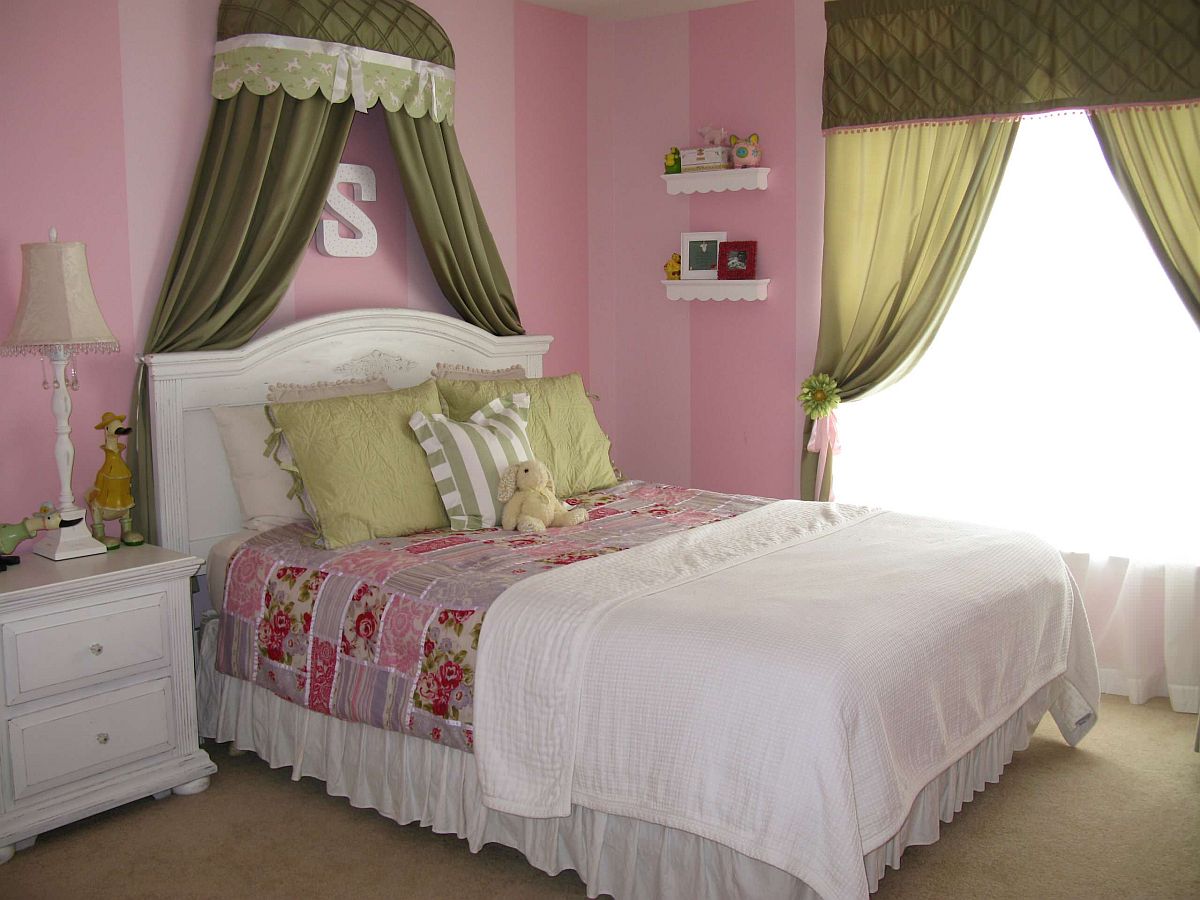 pink kids room with olive green bed canopy