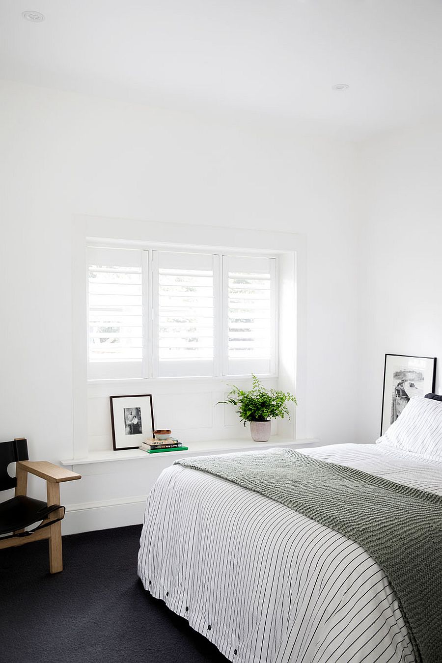 Light-filled bedroom in white of the revamped home in Sydney