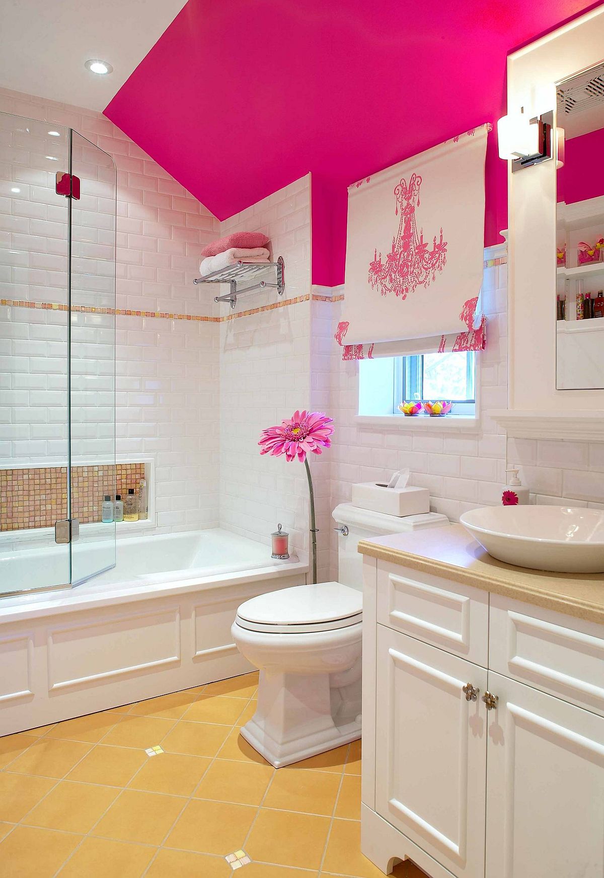 Little pops of pink accentuate it presence in this lovely modern white bathroom