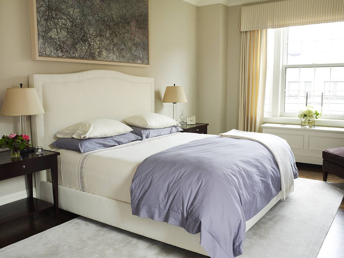 Modern bedroom of New York home in cream with light violet accents and a hint of greenery